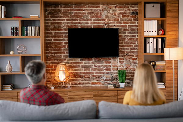 TV mounted on a brick wall with hidden wires by TV Mounting Experts in Charlotte