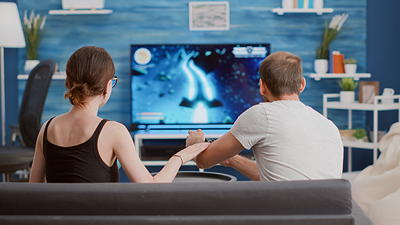 Homeowners enjoying a professionally wall-mounted TV with hidden wires