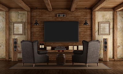 Living room home theater with mounted TV, surround sound, and concealed wiring