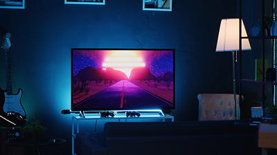 Gaming setup with PS5 console connected to wall-mounted TV with hidden cables