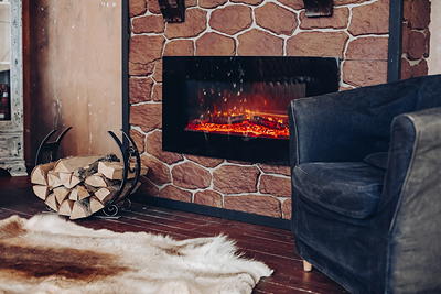 Electric fireplace installed in a modern living room with TV mounted above